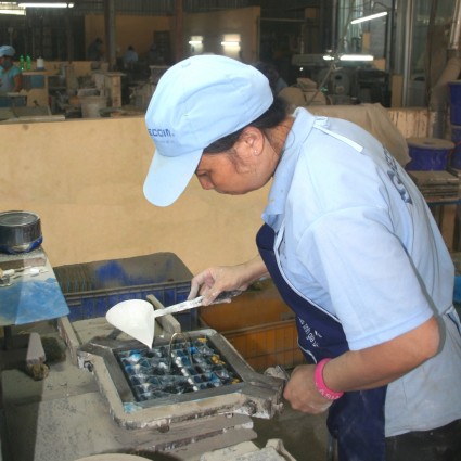 Pouring colours into the mould as the first layer